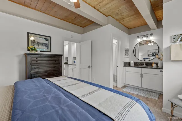 a bedroom with a bed and a dresser