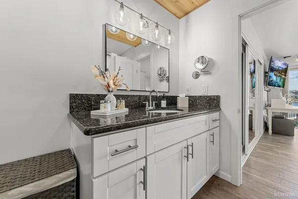 a view of a house with backyard porch and sitting area