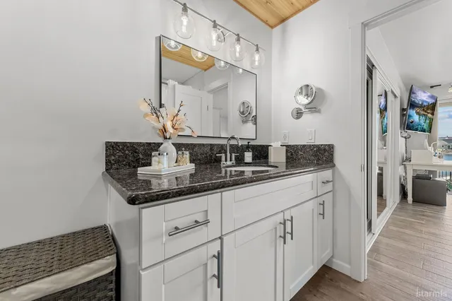 a bathroom with a sink and a mirror