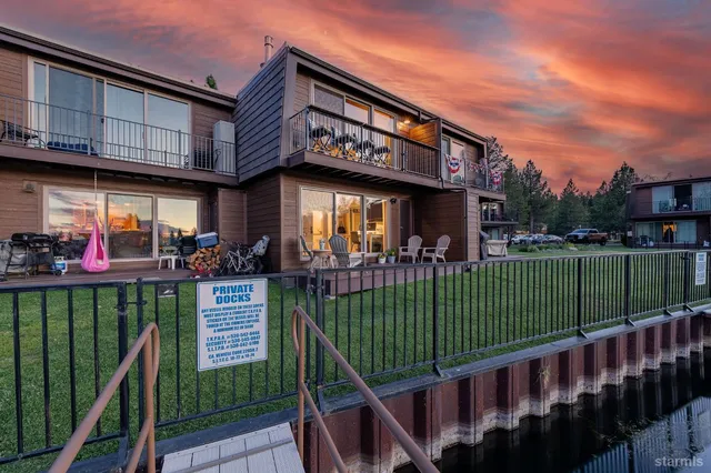 a view of a house with backyard porch and sitting area