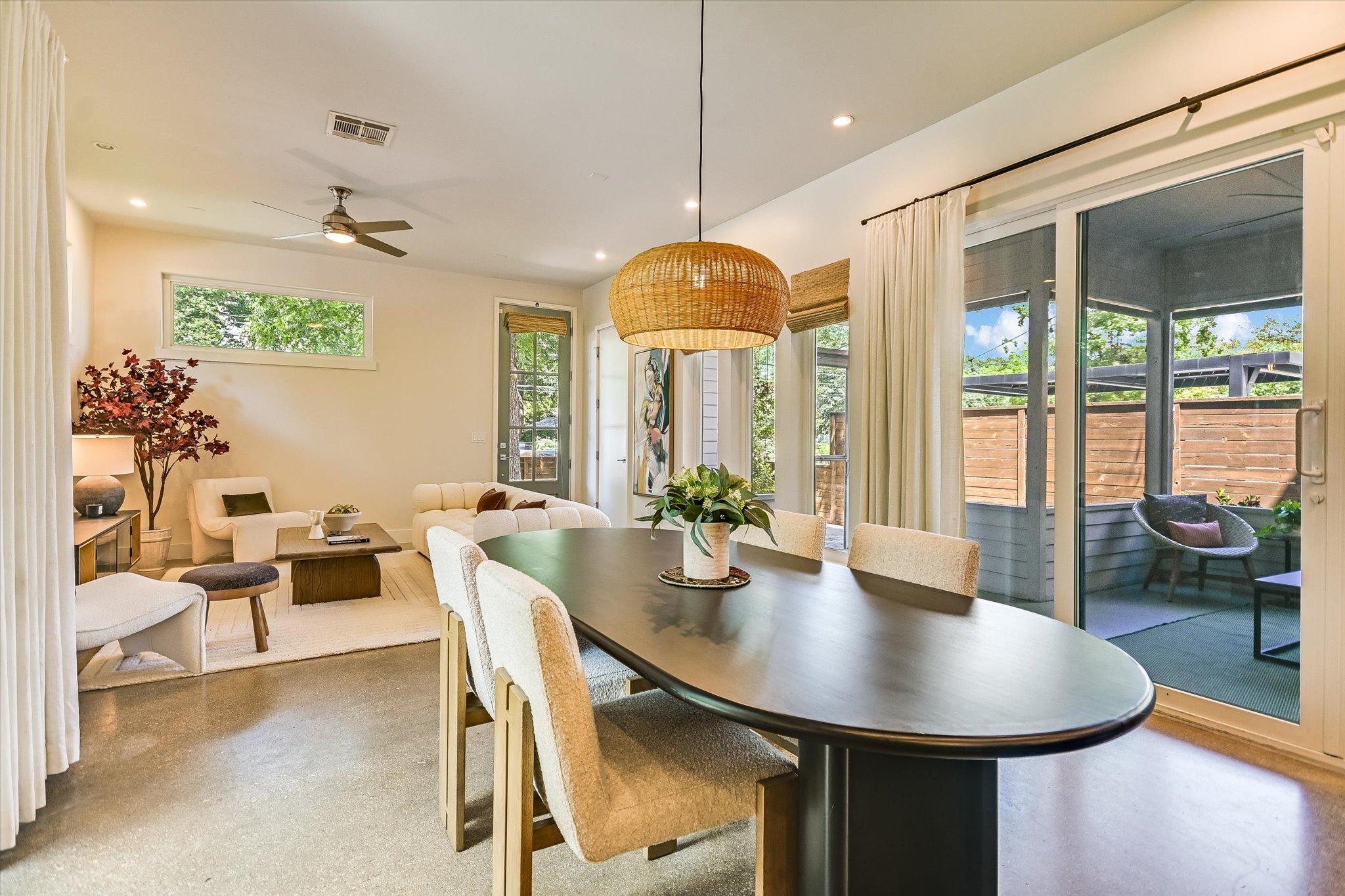 1605 Hether Street Austin, TX 78704 - Photo 9 of 26 Open-concept living space featuring a dining area with a woven pendant light fixture