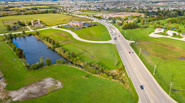 an aerial view of a house with a ocean view