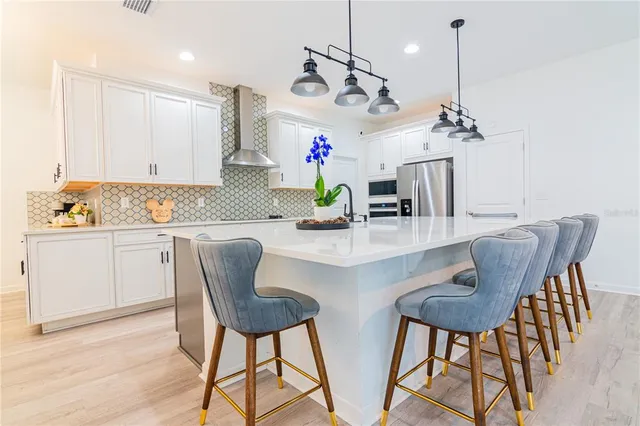 a white toilet sitting next to a white wall