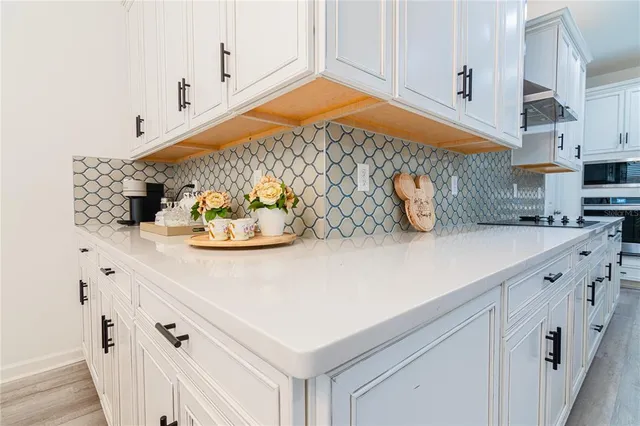 a bedroom with a bed and flat screen tv