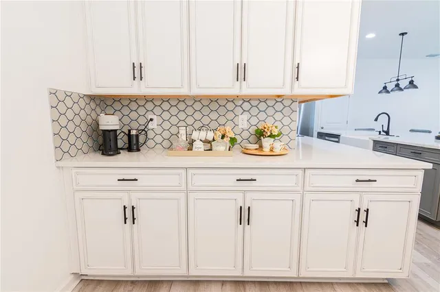a bathroom with double sink and a mirror