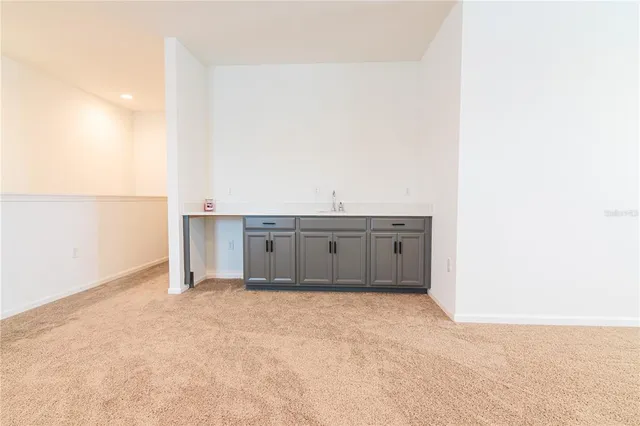 a bathroom with a sink a vanity and a mirror