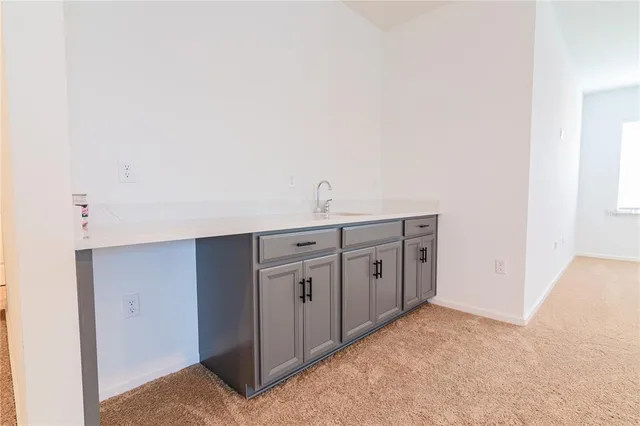 a bathroom with a sink toilet and a mirror