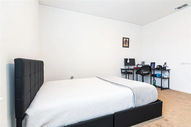 a bathroom with a sink mirror and vanity