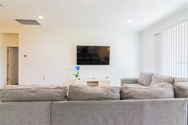 a kitchen with a sink a counter top space and stainless steel appliances
