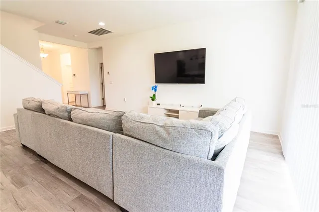 a kitchen with white cabinets a sink and appliances