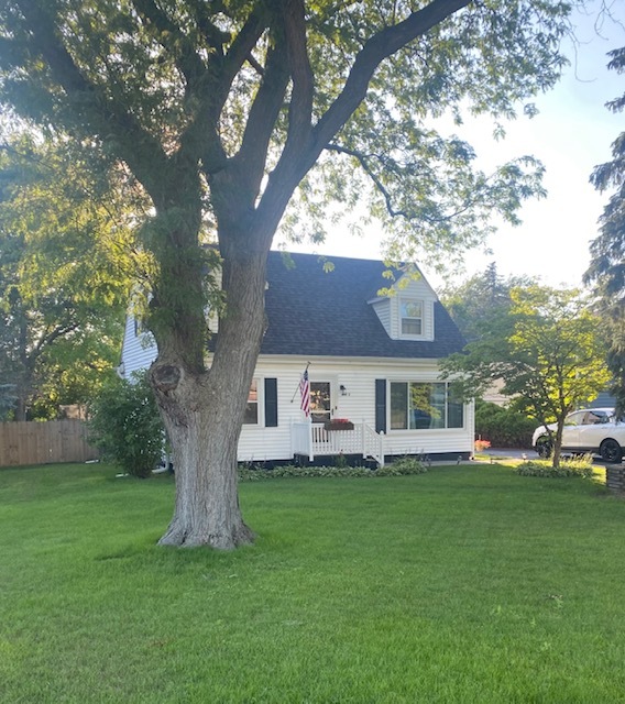 N720 Barry Avenue Wheaton, IL 60187 - Photo 1 of 1 a front view of house with a garden and trees