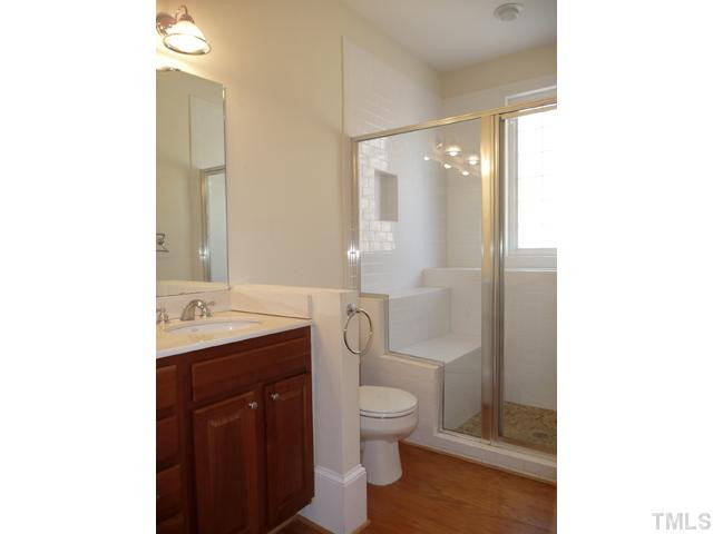 625 East Franklin Street Raleigh, NC 27604 - Photo 11 of 25 The unique large walk in master shower has a pebble stoned floor, tiled seating and large shower ledge with built in planter.