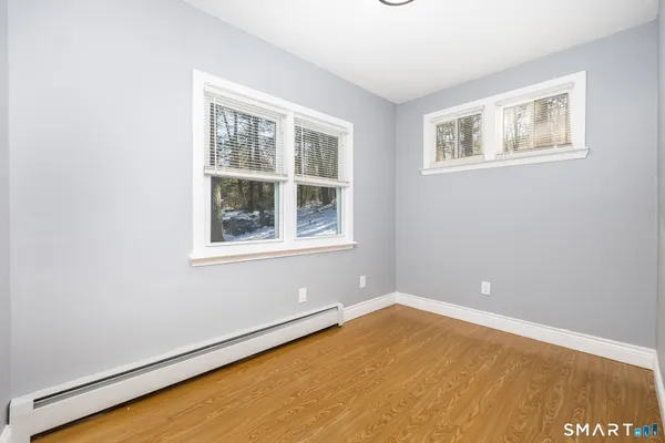 a view of empty room with windows