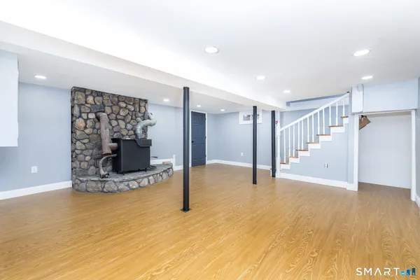 a view of an empty room with a fireplace