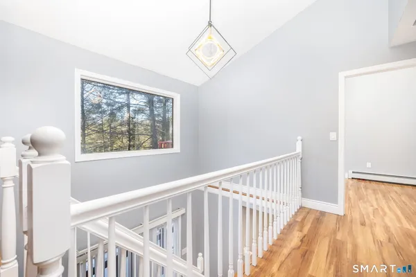 a view of entryway with wooden floor