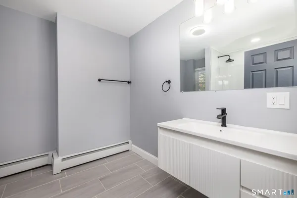 a bathroom with a sink and mirror