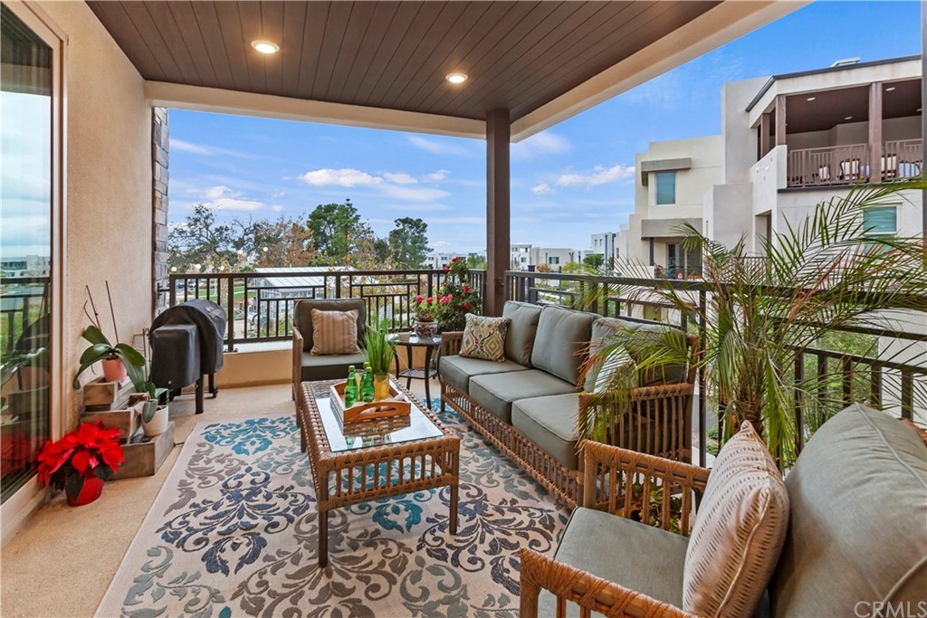 150 Catalyst Irvine, CA 92618 - Photo 7 of 25 a outdoor living space with furniture potted plant and a large window