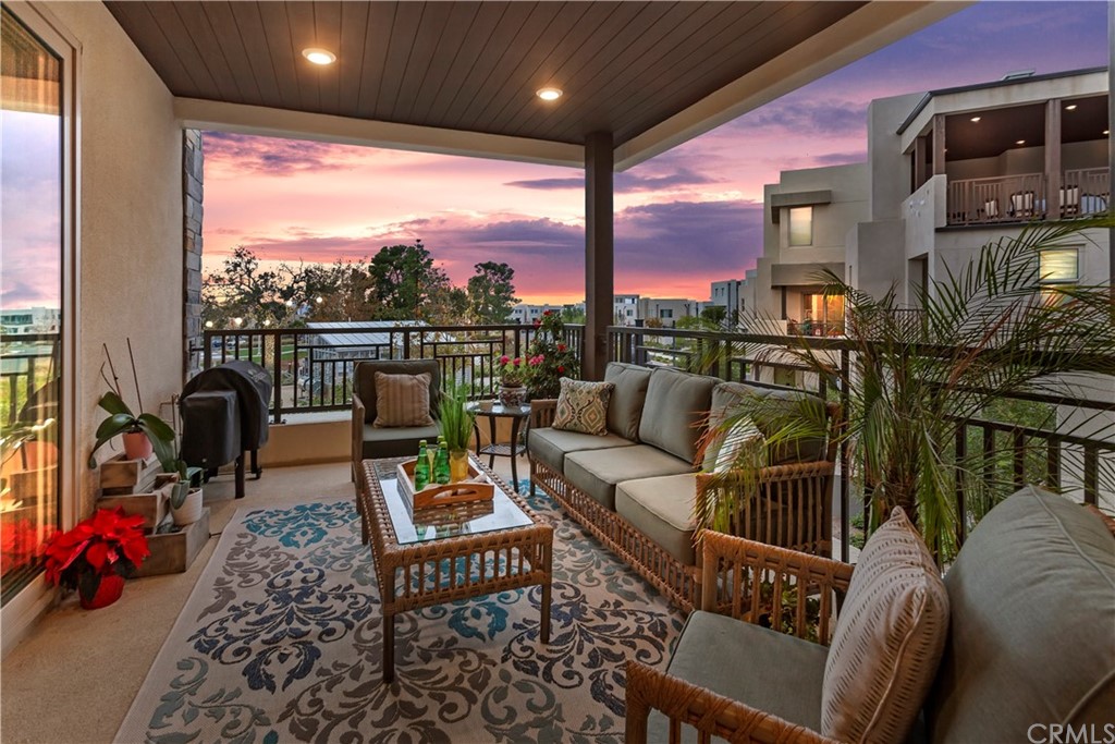150 Catalyst Irvine, CA 92618 - Photo 8 of 25 a living room with furniture a rug and a large window