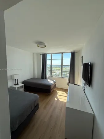 a view of an empty room with a window