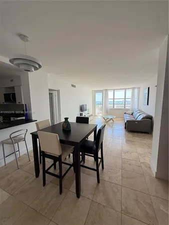 a kitchen with stainless steel appliances granite countertop a sink stove and microwave
