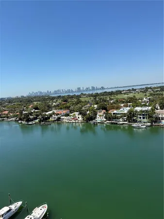 an aerial view of a house with a lake view