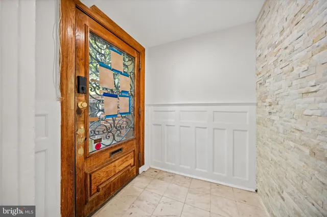 a bathroom with a shower a toilet and a sink