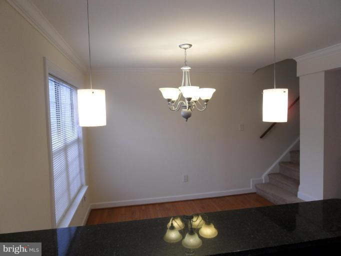 2388 Hunters Square Court Reston, VA 20191 - Photo 12 of 21 View from Kitchen to Dining Room & Staircase