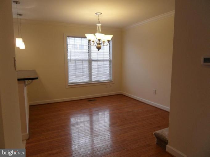 2388 Hunters Square Court Reston, VA 20191 - Photo 8 of 21 Dining Room with Granite Breakfast Bar