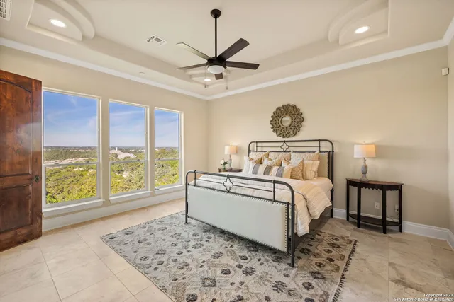 a bedroom with a large bed and a window