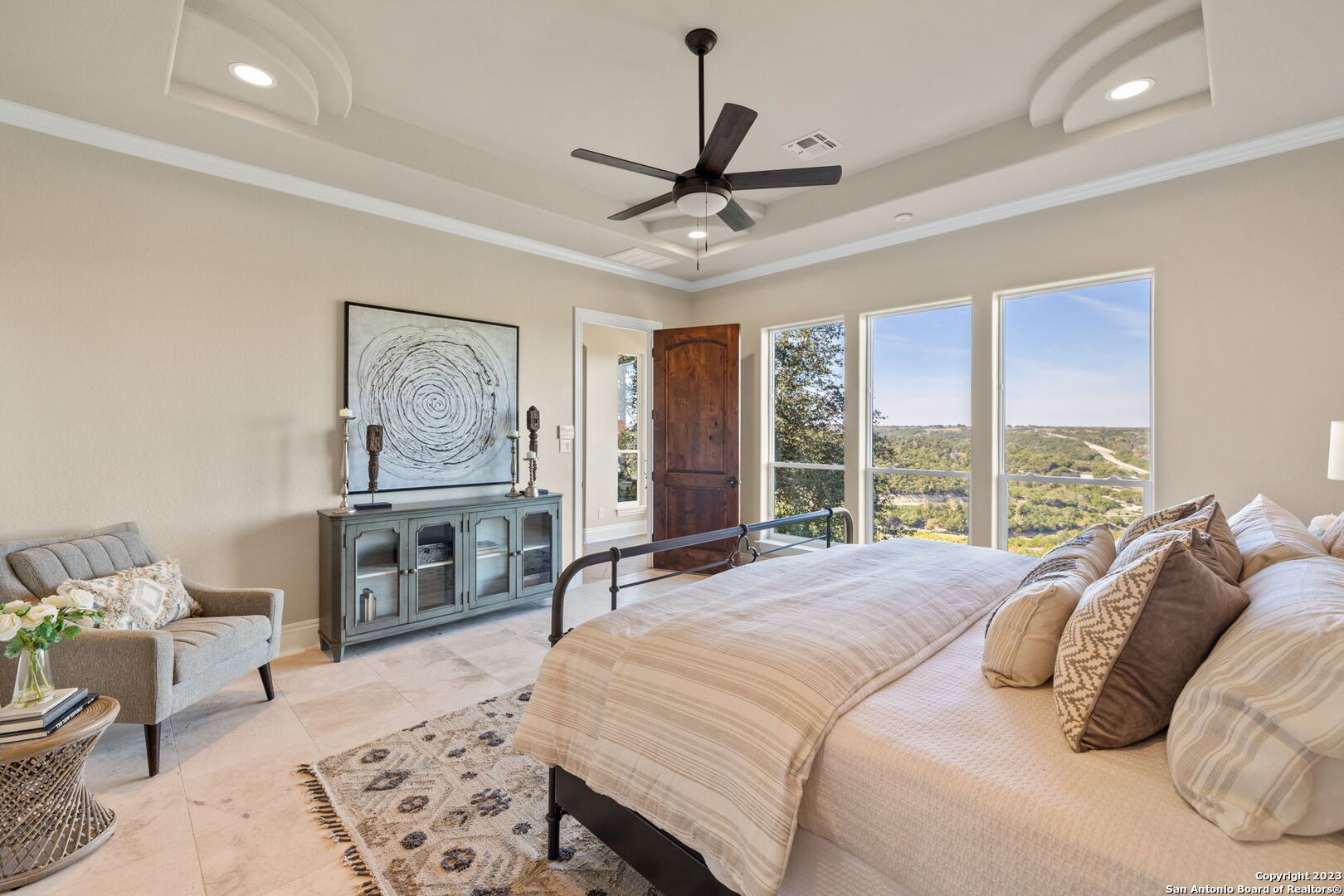 204 Paradise Point Drive Boerne, TX 78006 - Photo 18 of 32 a bedroom with a bed a couch and a window