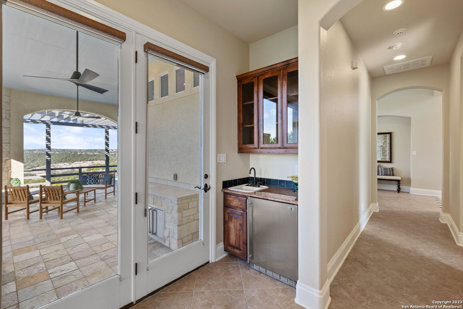 204 Paradise Point Drive Boerne, TX 78006 - Photo 24 of 32 a kitchen with stainless steel appliances granite countertop a refrigerator and a view of living room