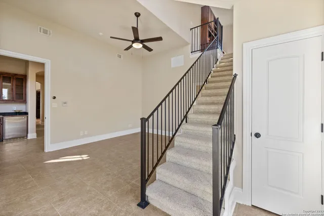 a view of a hallway with wooden floor and entryway