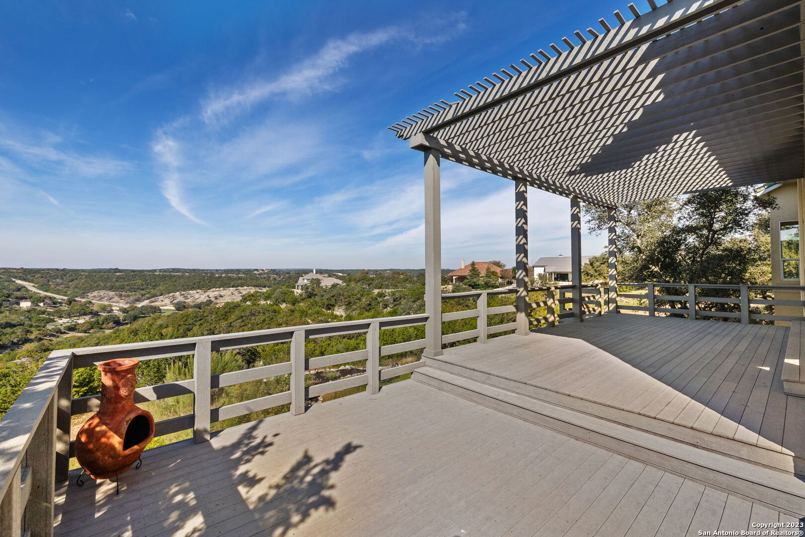 204 Paradise Point Drive Boerne, TX 78006 - Photo 3 of 32 a view of a terrace with wooden floor and fence