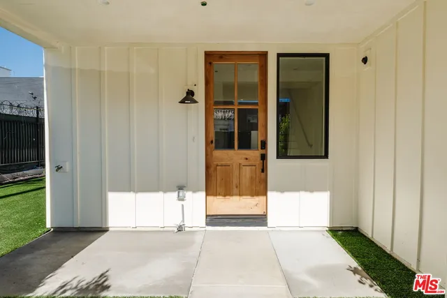 a bathroom with a window and a mirror