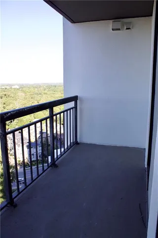 a view of a balcony with chairs