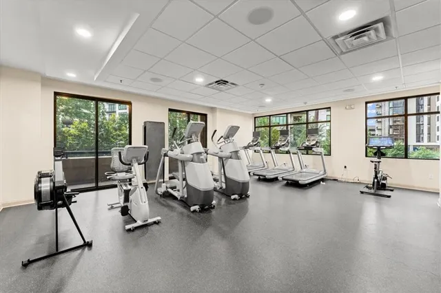 a living room with furniture and a lamp