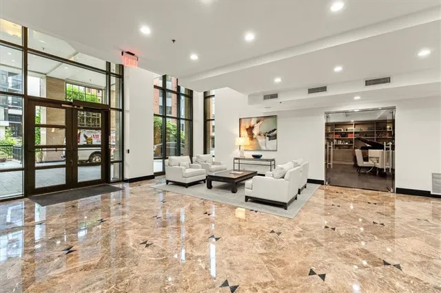 a living room with furniture fireplace and flat screen tv