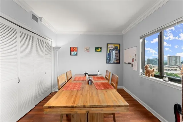 a view of a dining room with furniture window and wooden floor