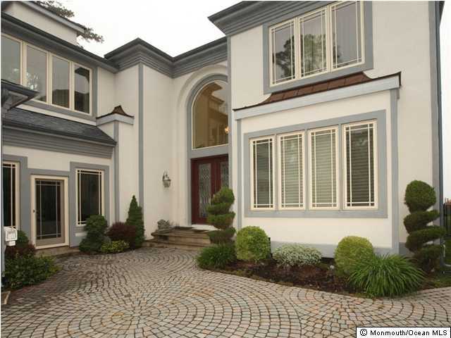368 Mantoloking Road Brick, NJ 08723 - Photo 1 of 3 a front view of a house with a yard
