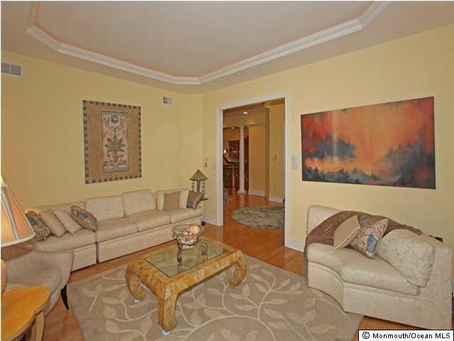 368 Mantoloking Road Brick, NJ 08723 - Photo 3 of 3 a living room with furniture and a large window