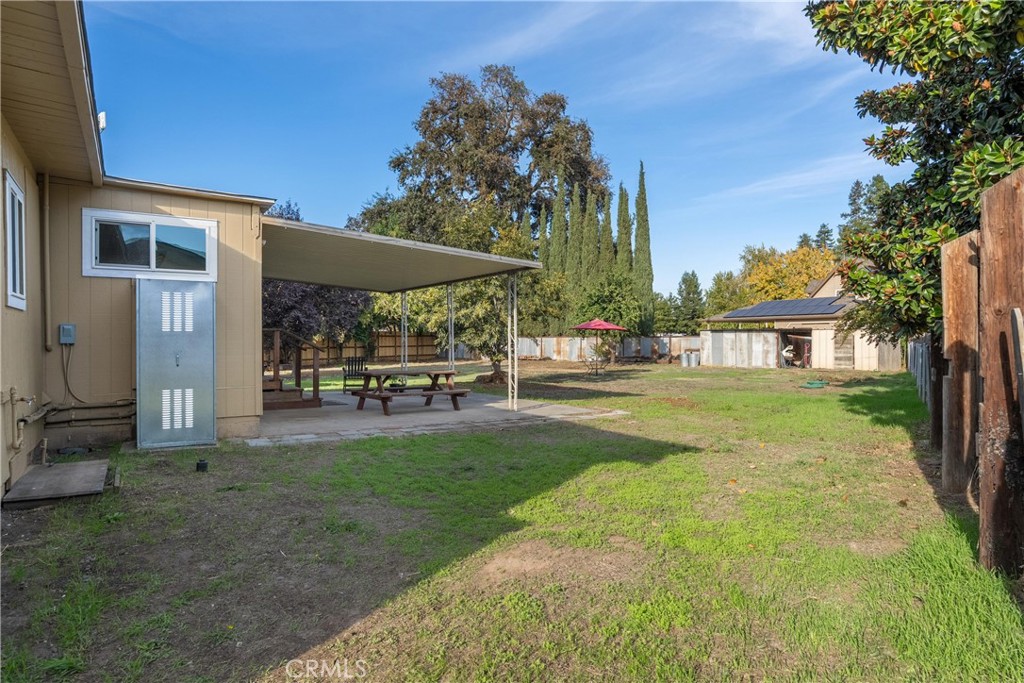 5574 California Street Chico, CA 95973 - Photo 22 of 30 a view of a house with backyard porch and garden