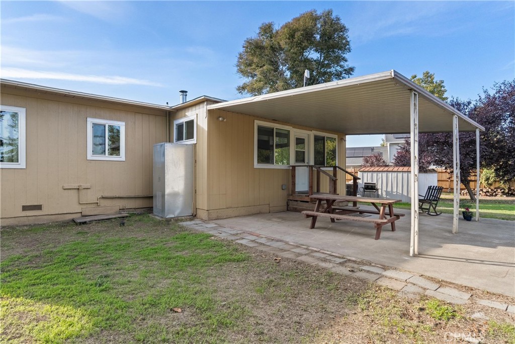5574 California Street Chico, CA 95973 - Photo 25 of 30 a backyard of a house with table and chairs