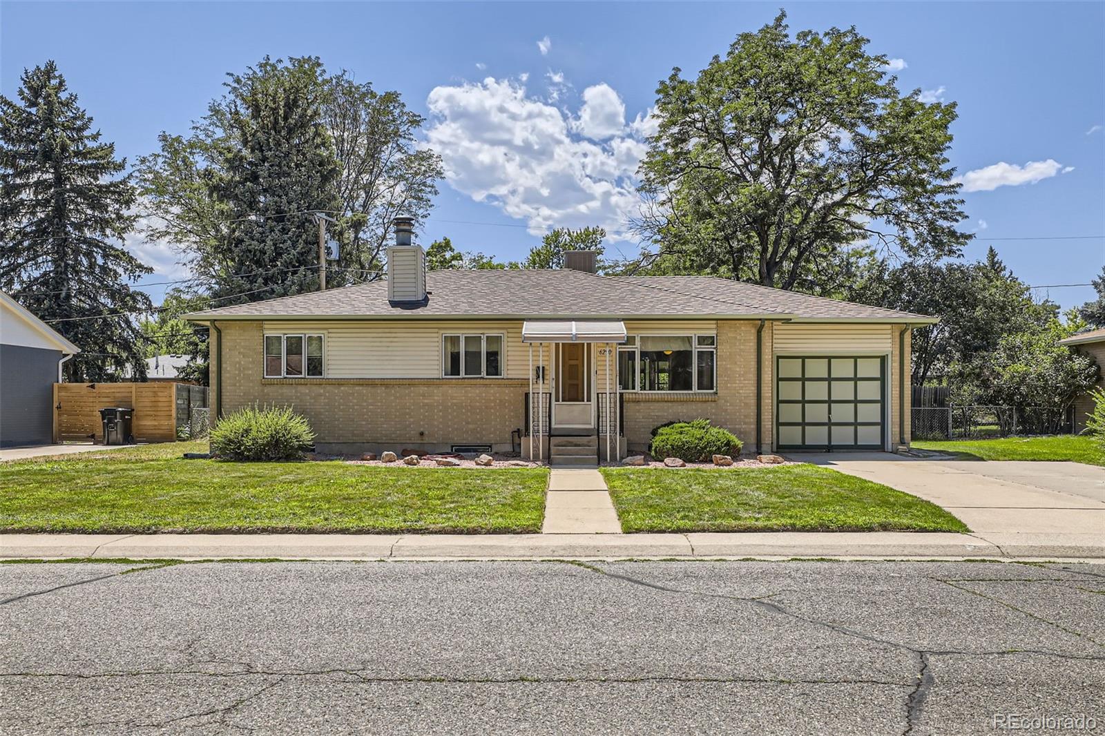 front view of a house and a yard