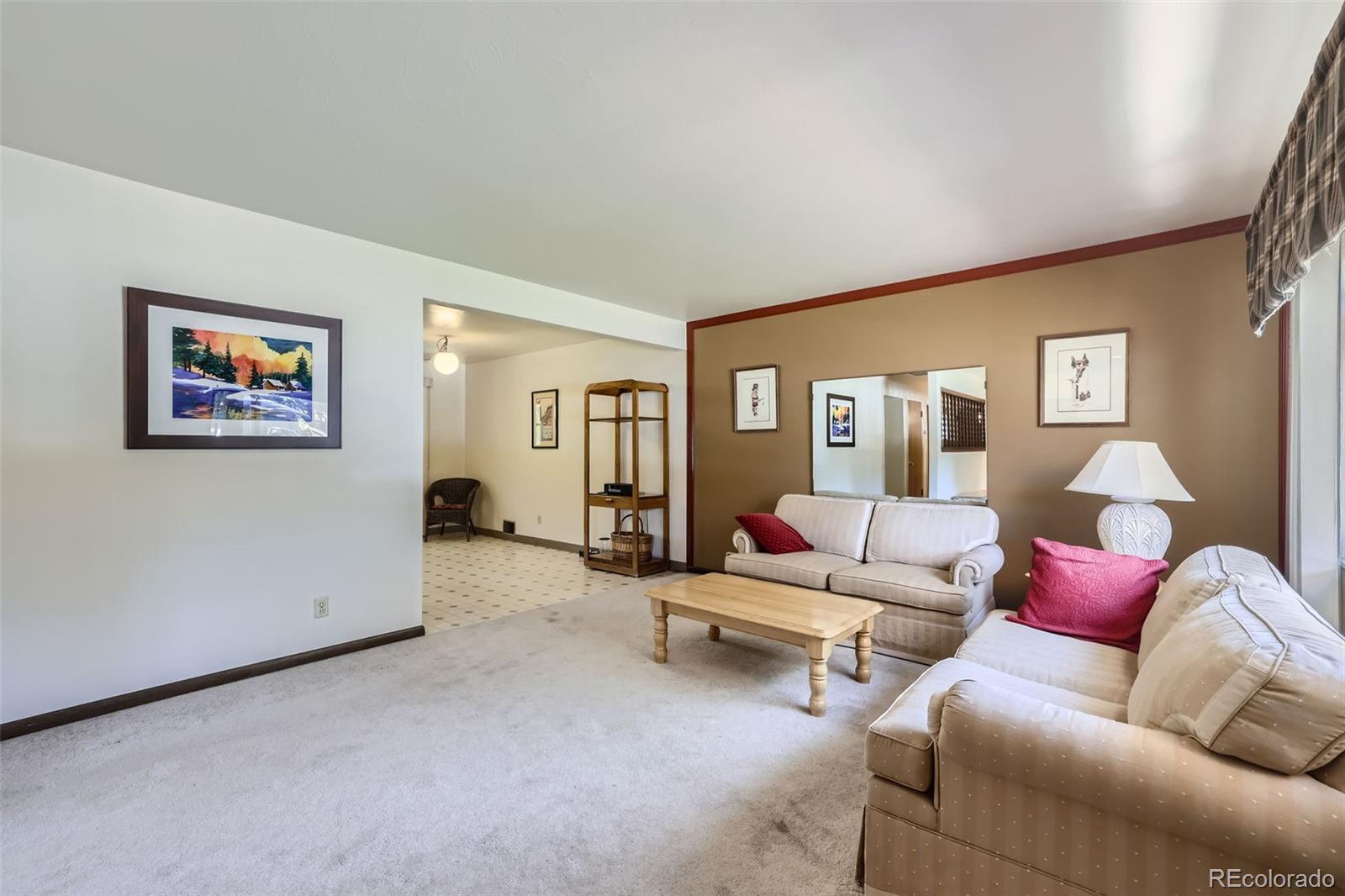 6290 Janice Way Arvada, CO 80004 - Photo 12 of 28 a living room with furniture and a couch