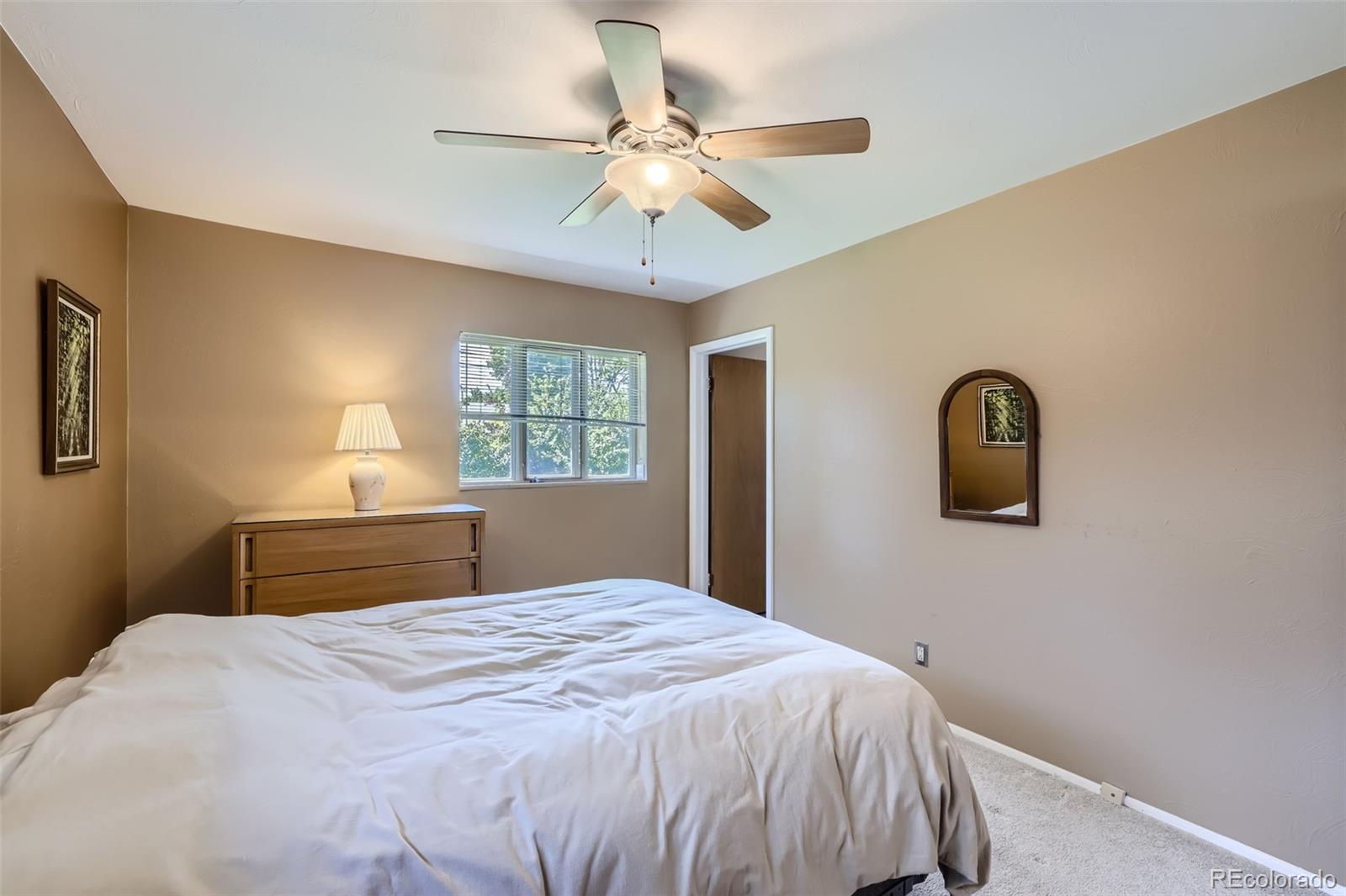 6290 Janice Way Arvada, CO 80004 - Photo 15 of 28 a bedroom with a bed and a window