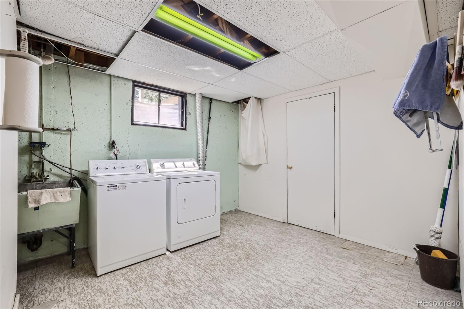 6290 Janice Way Arvada, CO 80004 - Photo 26 of 28 a utility room with dryer and washer