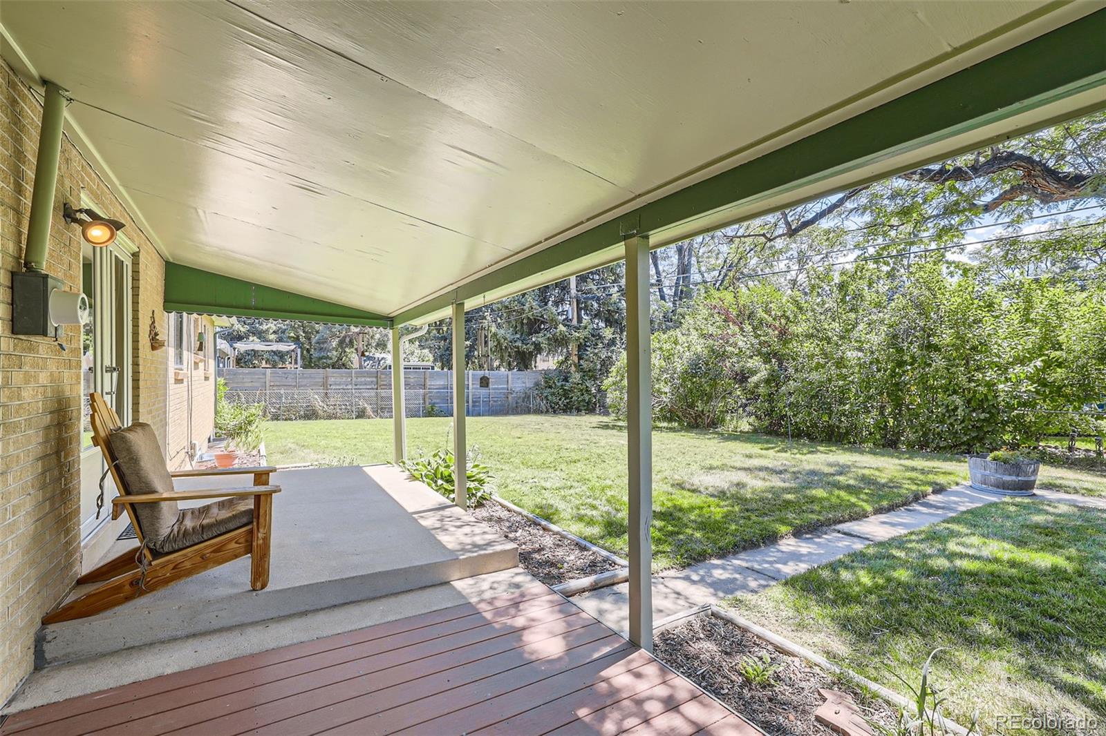 6290 Janice Way Arvada, CO 80004 - Photo 27 of 28 a view of porch with wooden floor