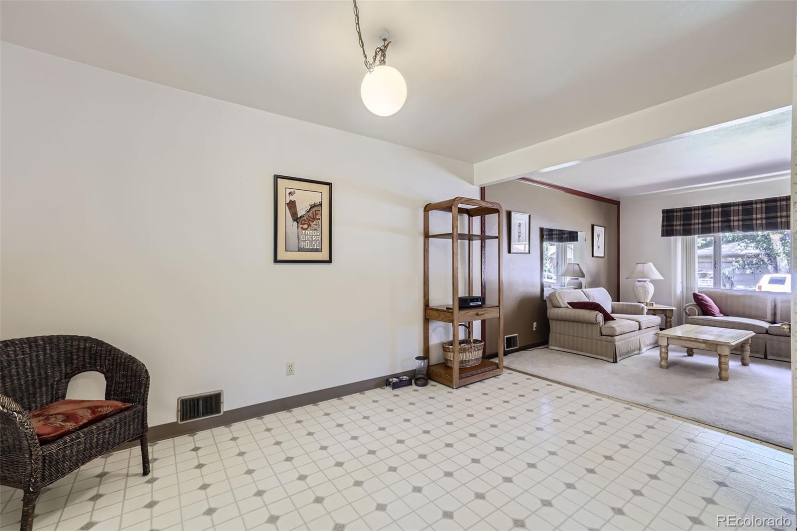 6290 Janice Way Arvada, CO 80004 - Photo 7 of 28 a bedroom with furniture and a window