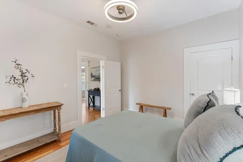 a bedroom with a bed and a dresser