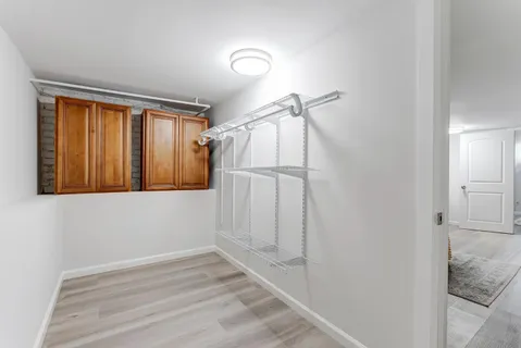 a bedroom with a bed and a chair